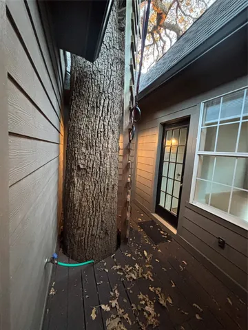 a view of porch with a door and wooden floor