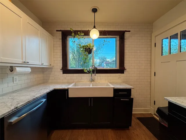 a kitchen with a sink and cabinets