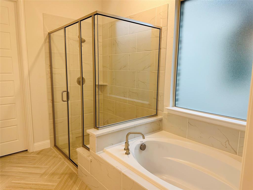 1605 Hart Drive Mansfield, TX 76063 - Photo 12 of 21 a bathroom with a shower and a tub