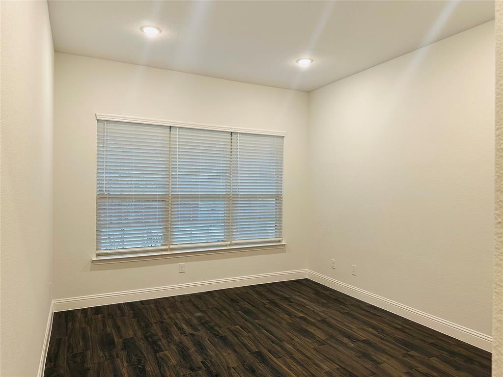 1605 Hart Drive Mansfield, TX 76063 - Photo 13 of 21 an empty room with wooden floor and windows