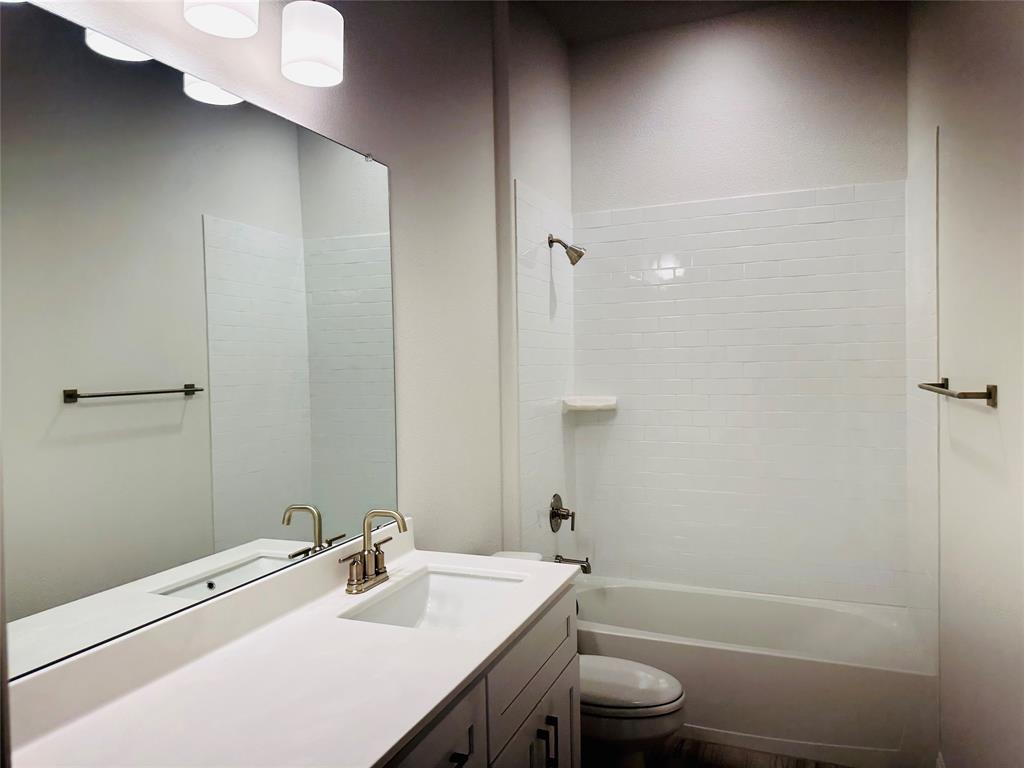 1605 Hart Drive Mansfield, TX 76063 - Photo 18 of 21 a bathroom with a sink a toilet and shower