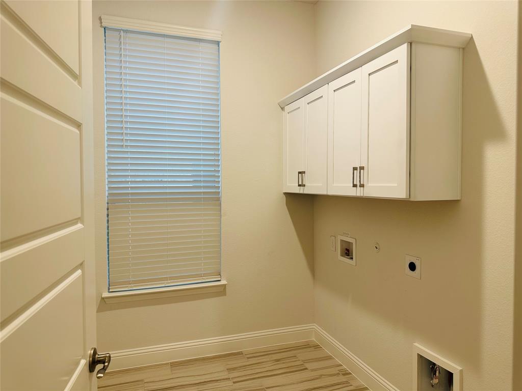 1605 Hart Drive Mansfield, TX 76063 - Photo 20 of 21 a view of a closet area with wooden floor
