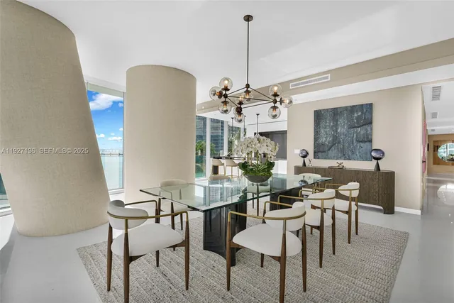 a bedroom with a large bed and a large window