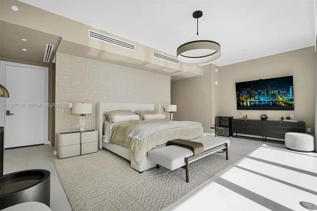 a bedroom with a bed and a couch