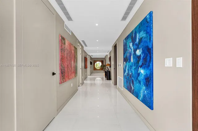 a bedroom with a bed cabinets and walk in closet