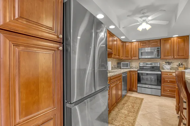 a bedroom with a bed a couch and a window