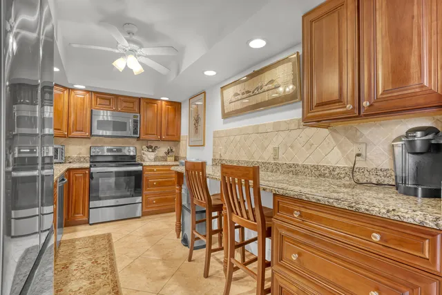 a view of a city from a bedroom with furniture