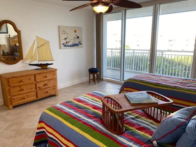 a bathroom with a granite countertop toilet sink and mirror