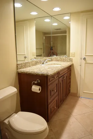 a kitchen with granite countertop a stove and a sink