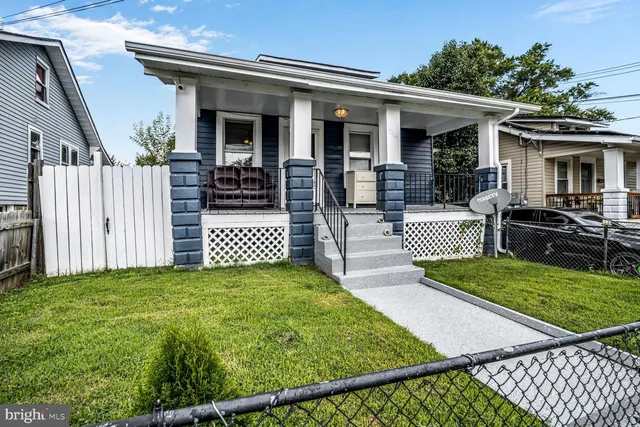 a view of backyard with a deck and wooden floor