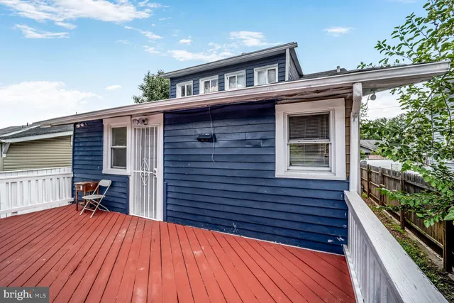 a view of a porch with wooden floor and fence