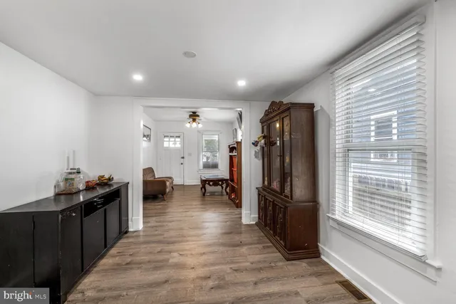 a very nice looking room with wooden floor and a window