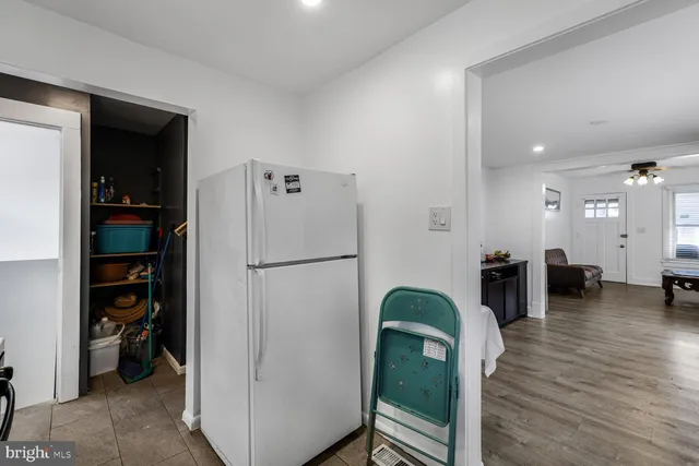 a view of living room with furniture and wooden floor
