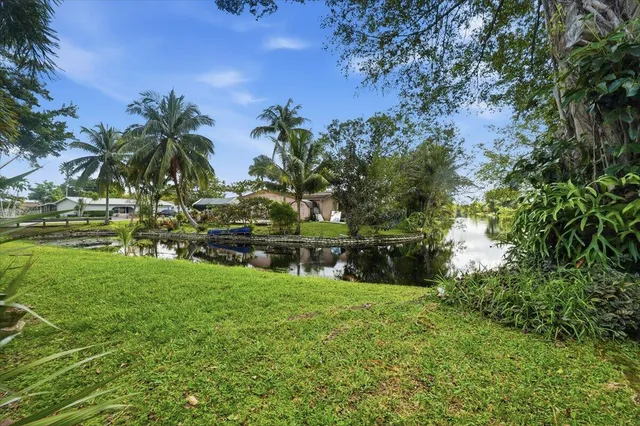 a view of lake with a yard