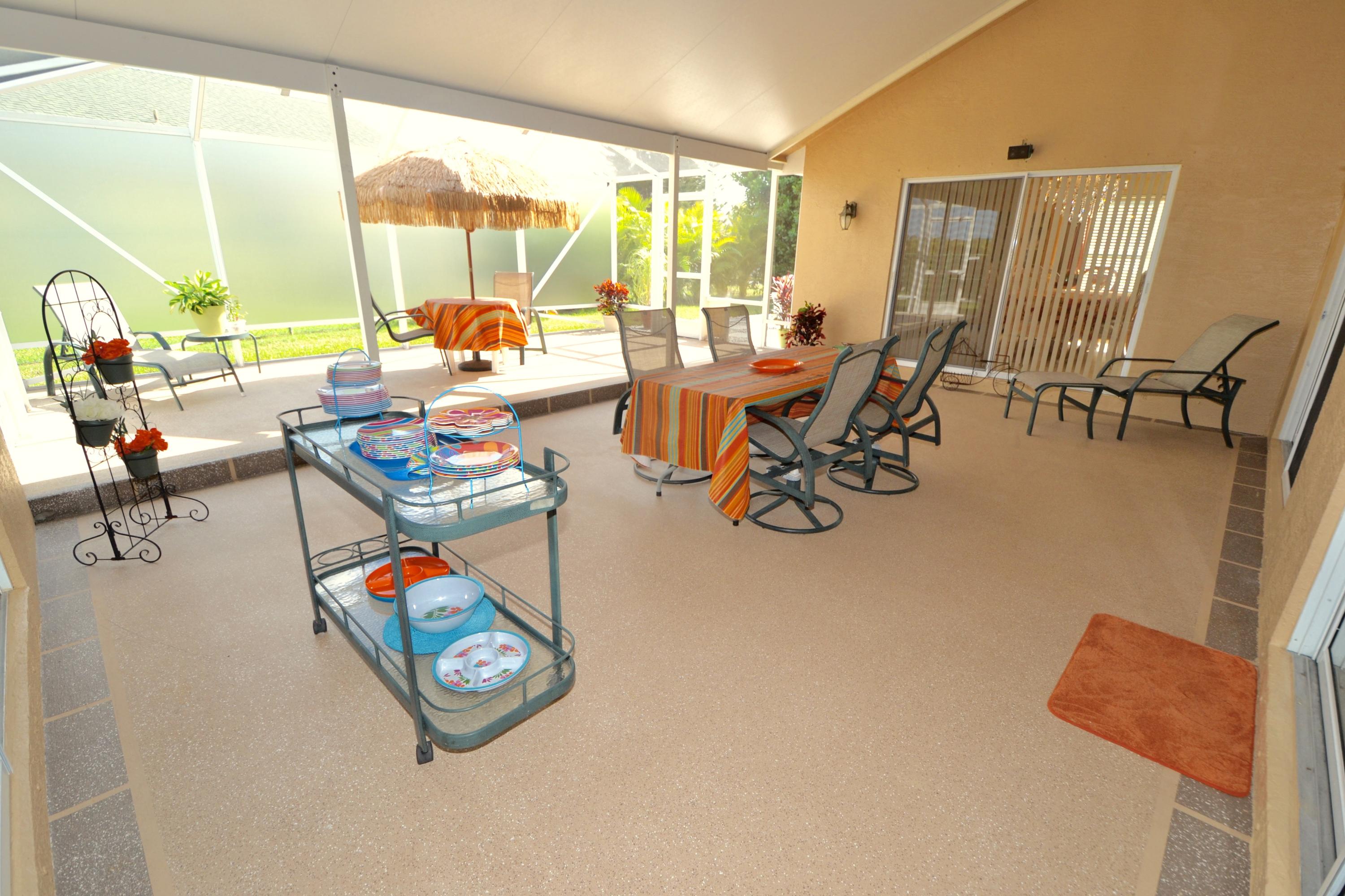9021 Southwest Chevy Circle Stuart, FL 34997 - Photo 32 of 79 LARGE COVERED/SCREENED PATIO