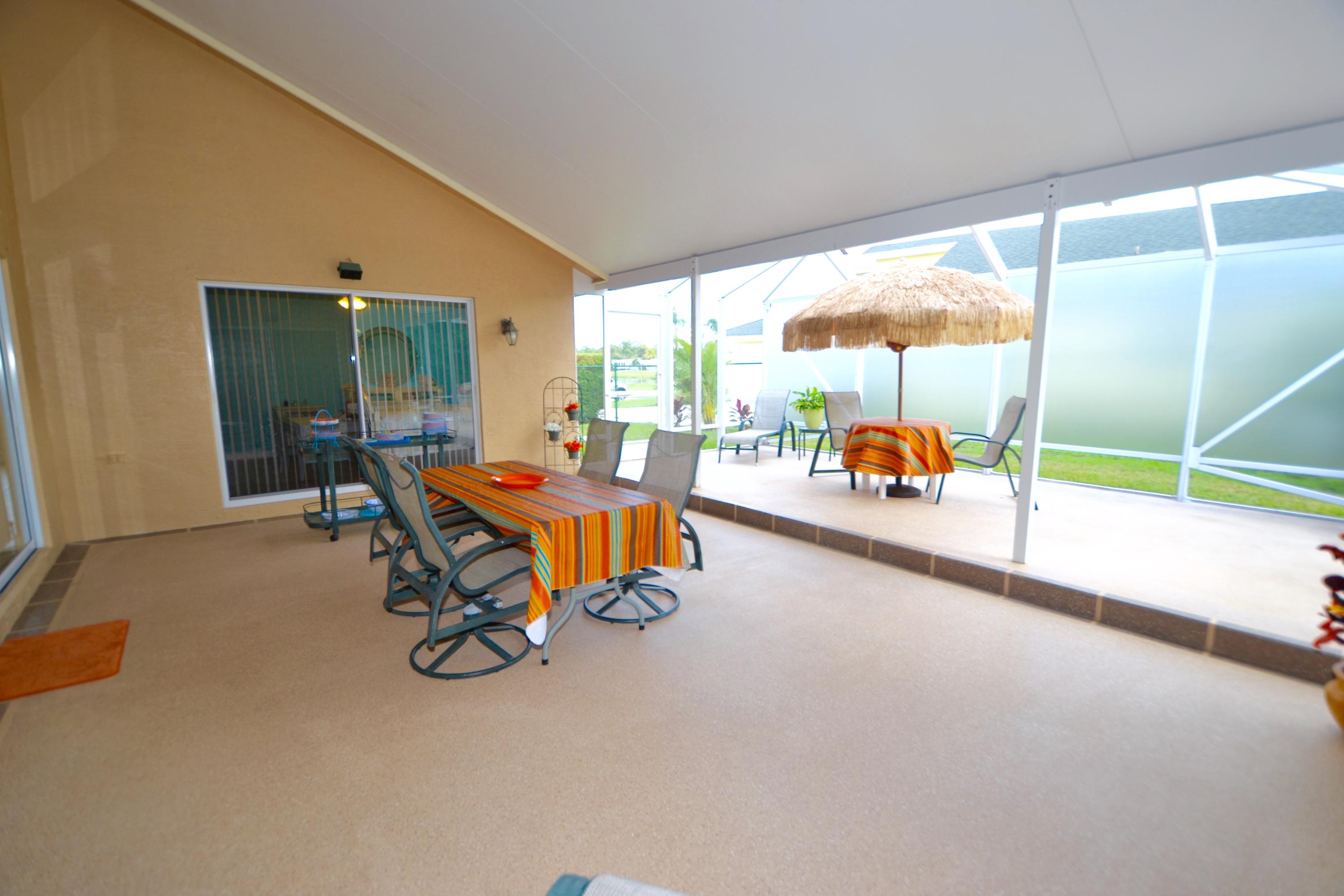 9021 Southwest Chevy Circle Stuart, FL 34997 - Photo 34 of 79 LARGE COVERED/SCREENED PATIO