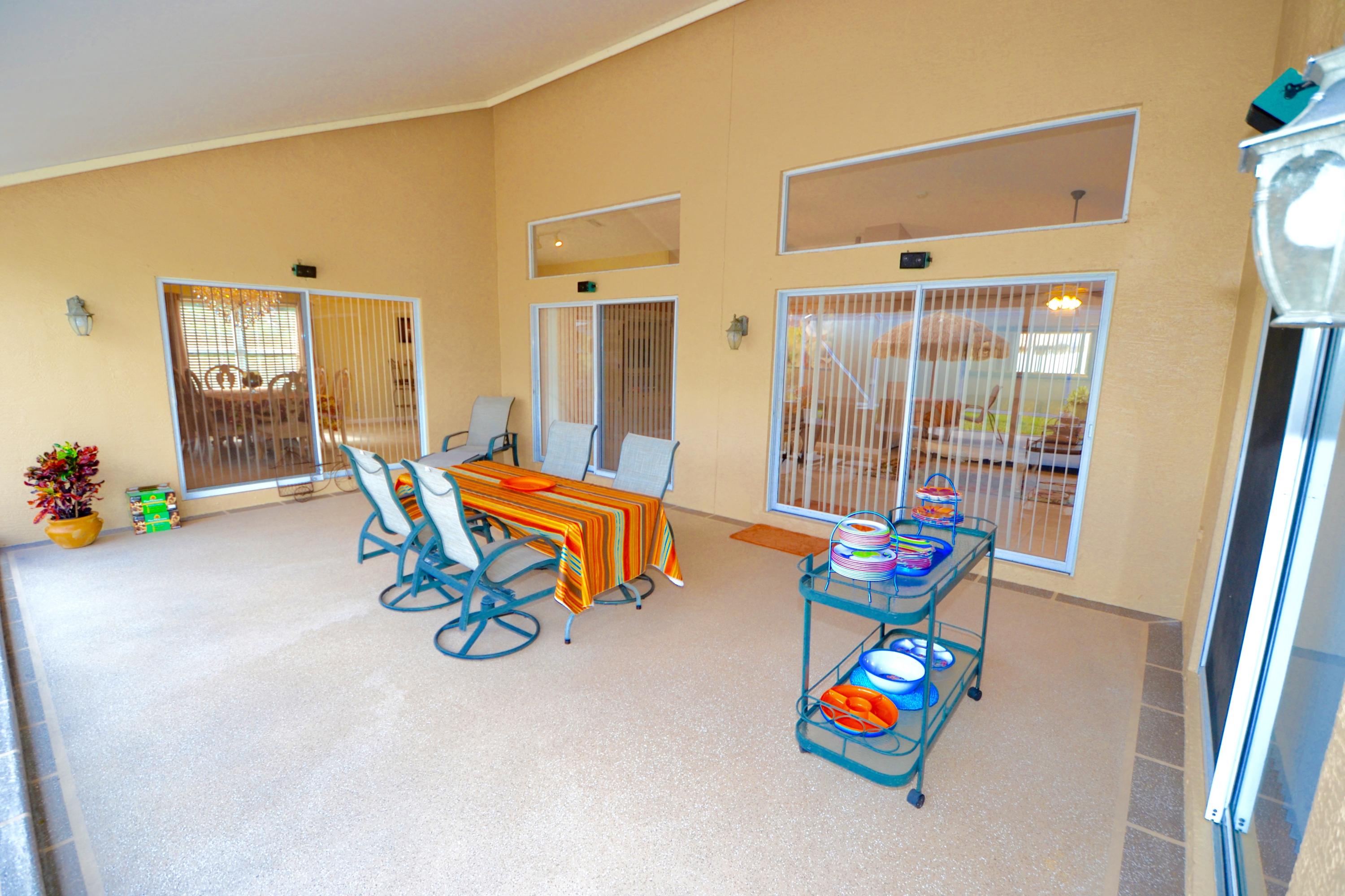 9021 Southwest Chevy Circle Stuart, FL 34997 - Photo 35 of 79 LARGE COVERED/SCREENED PATIO