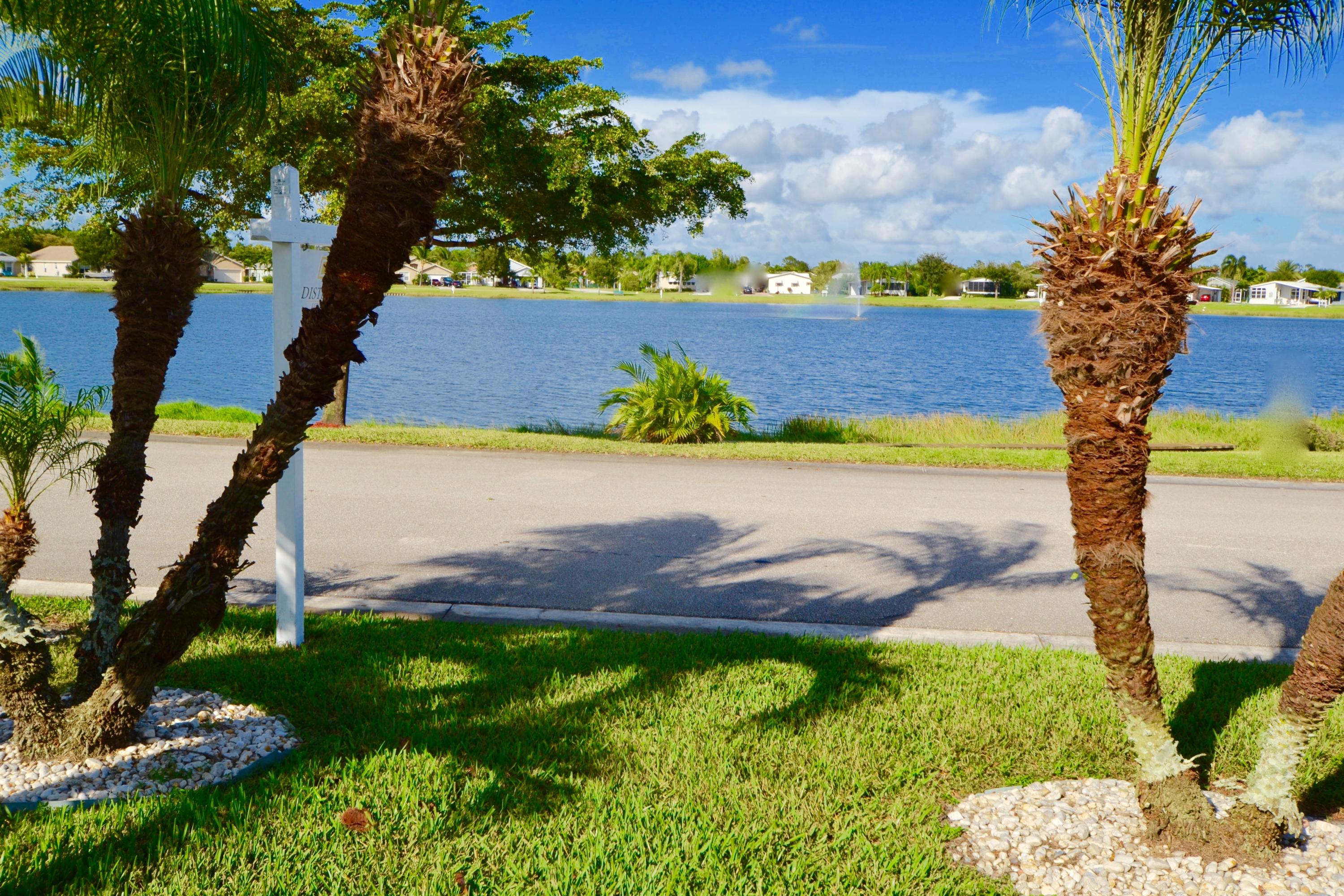9021 Southwest Chevy Circle Stuart, FL 34997 - Photo 48 of 79 FRONTYARD PATIO LOOKS OUT TO LAKE