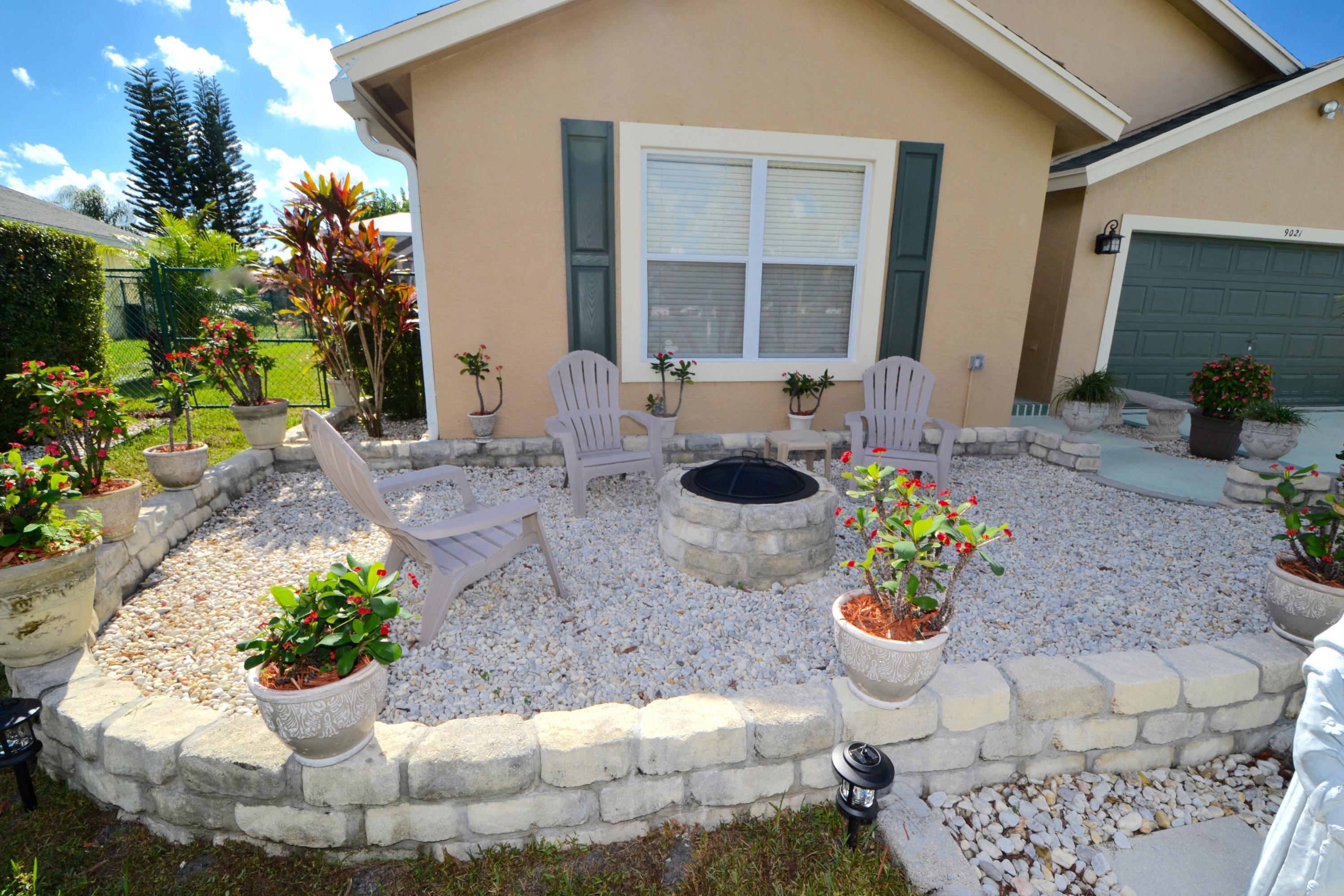 9021 Southwest Chevy Circle Stuart, FL 34997 - Photo 58 of 79 FRONTYARD CONVERSATION PIT