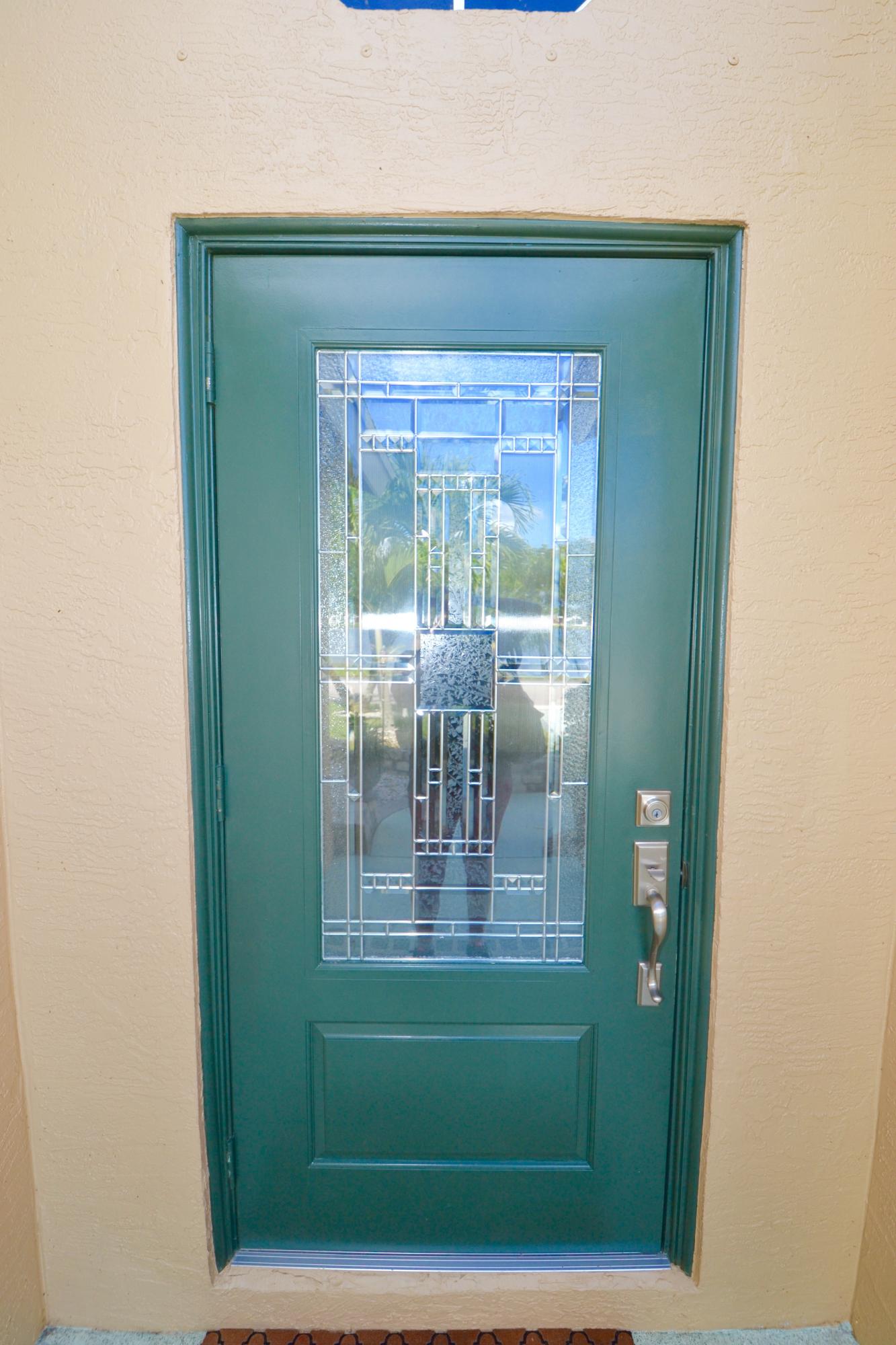 9021 Southwest Chevy Circle Stuart, FL 34997 - Photo 61 of 79 NEW LEADED IMPACT GLASS FRONT DOOR
