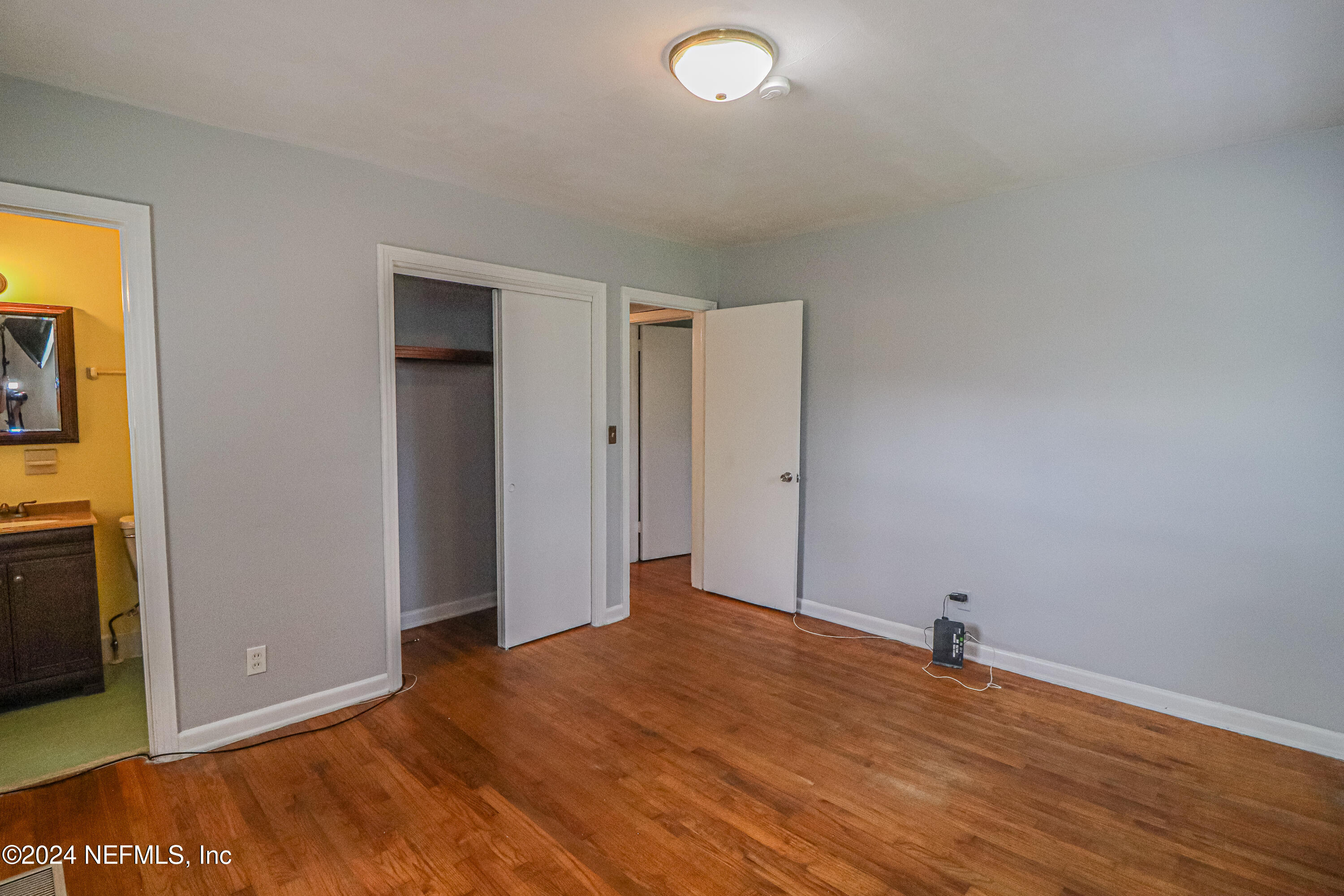 6503 Ector Road Jacksonville, FL 32211 - Photo 11 of 25 a view of empty room with wooden floor