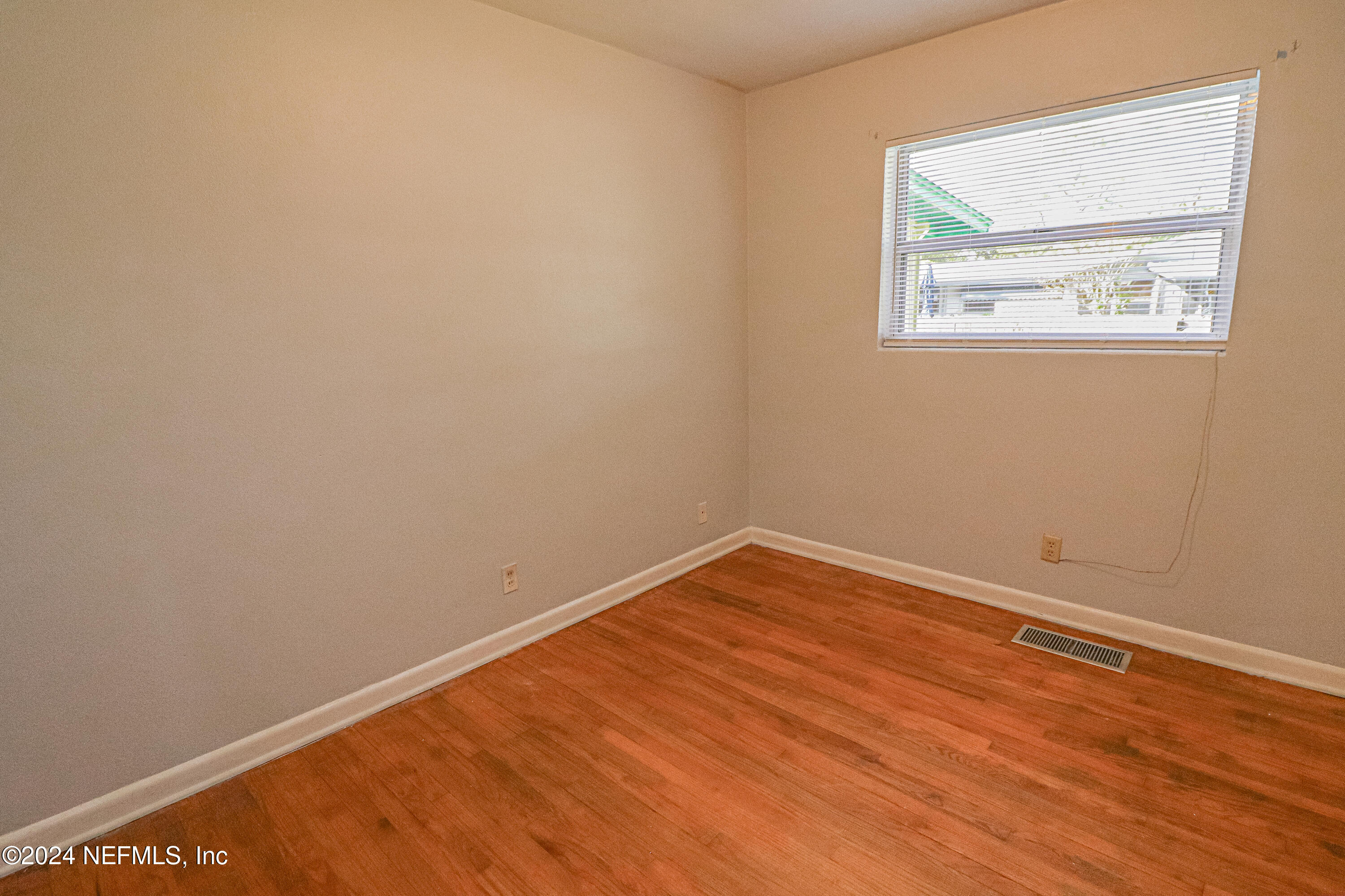 6503 Ector Road Jacksonville, FL 32211 - Photo 12 of 25 an empty room with a window