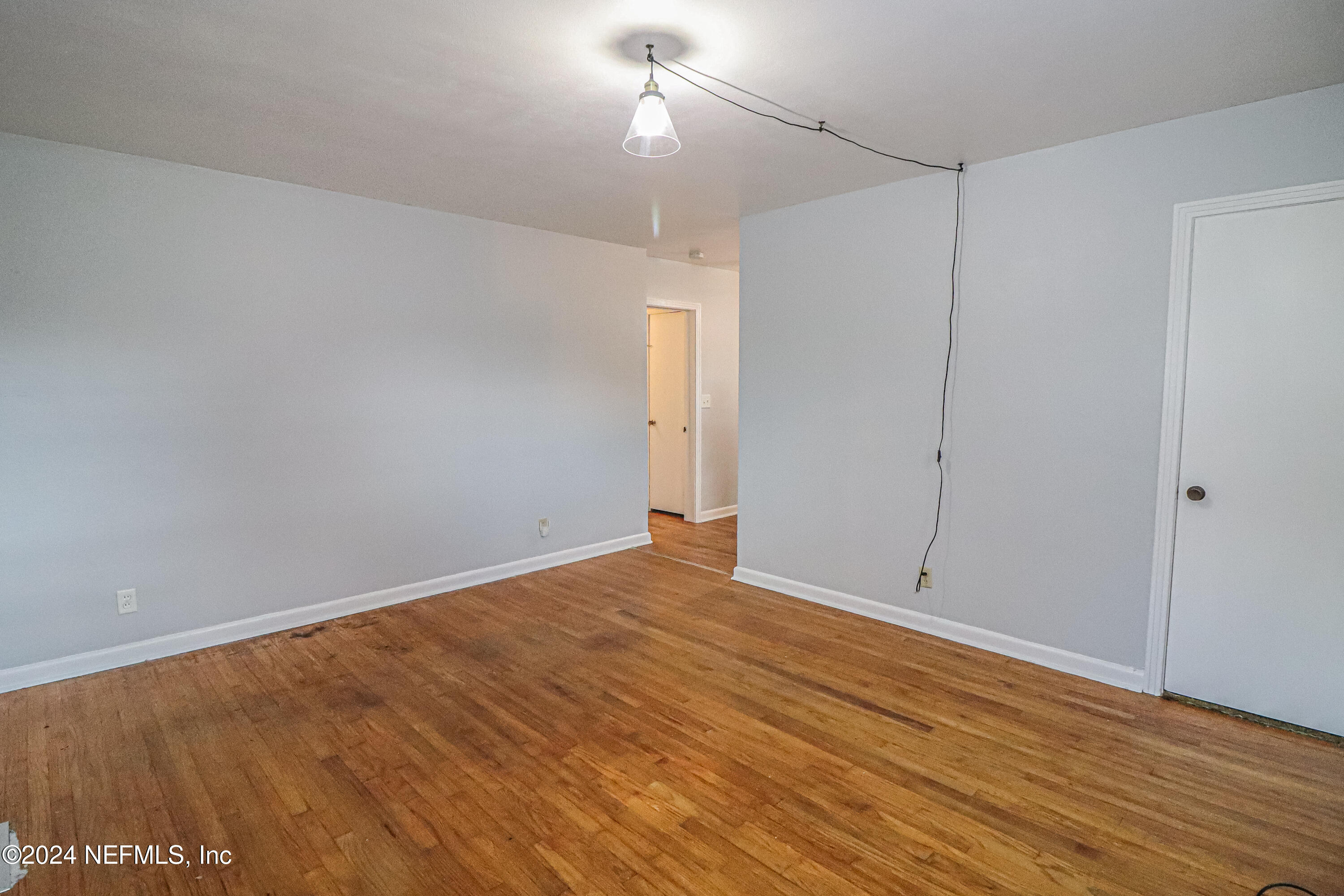 6503 Ector Road Jacksonville, FL 32211 - Photo 15 of 25 a view of an empty room with wooden floor
