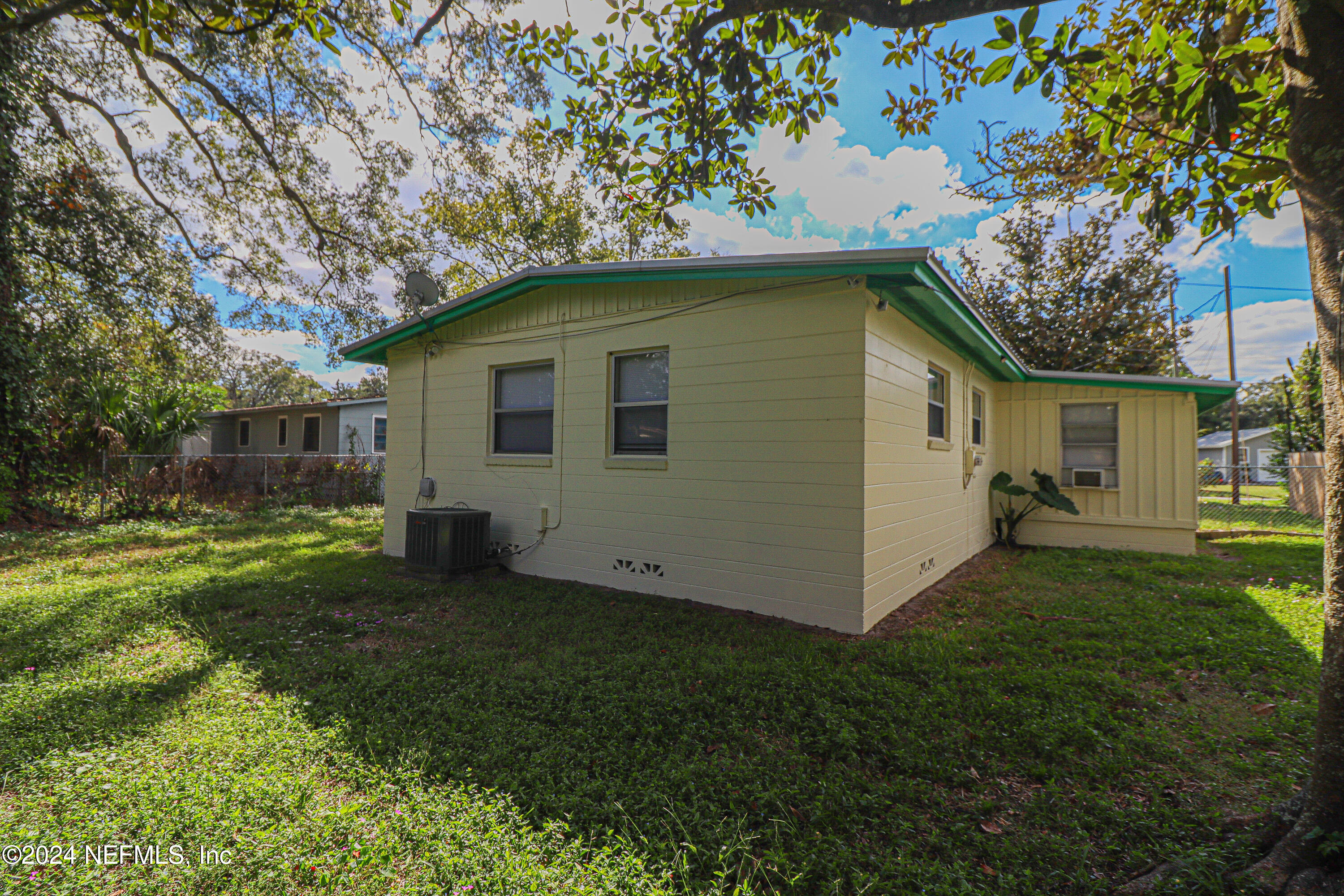 6503 Ector Road Jacksonville, FL 32211 - Photo 23 of 25 a front view of a house with a garden