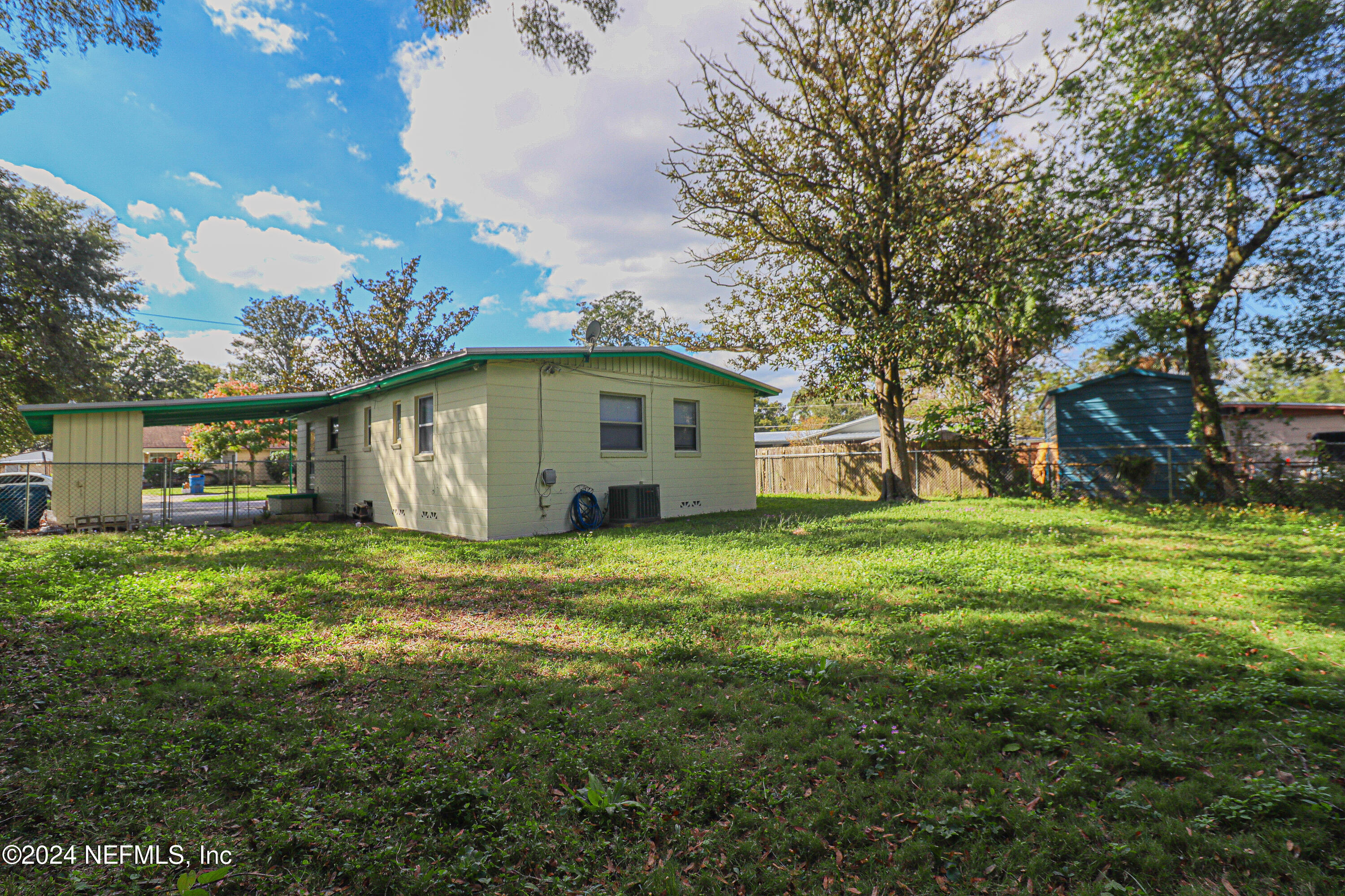 6503 Ector Road Jacksonville, FL 32211 - Photo 25 of 25 a view of a backyard with plants and large trees