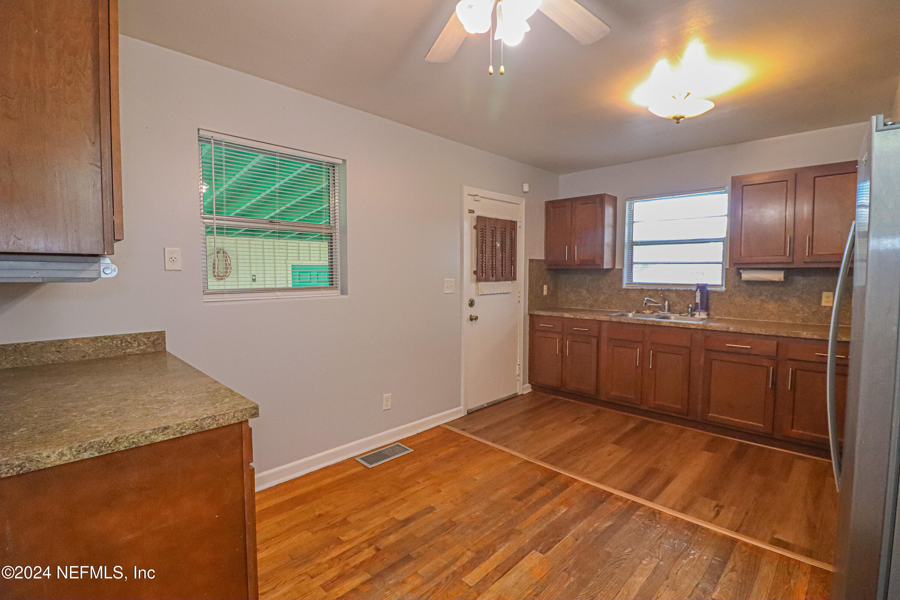6503 Ector Road Jacksonville, FL 32211 - Photo 9 of 25 a kitchen with stainless steel appliances granite countertop a sink stove and refrigerator