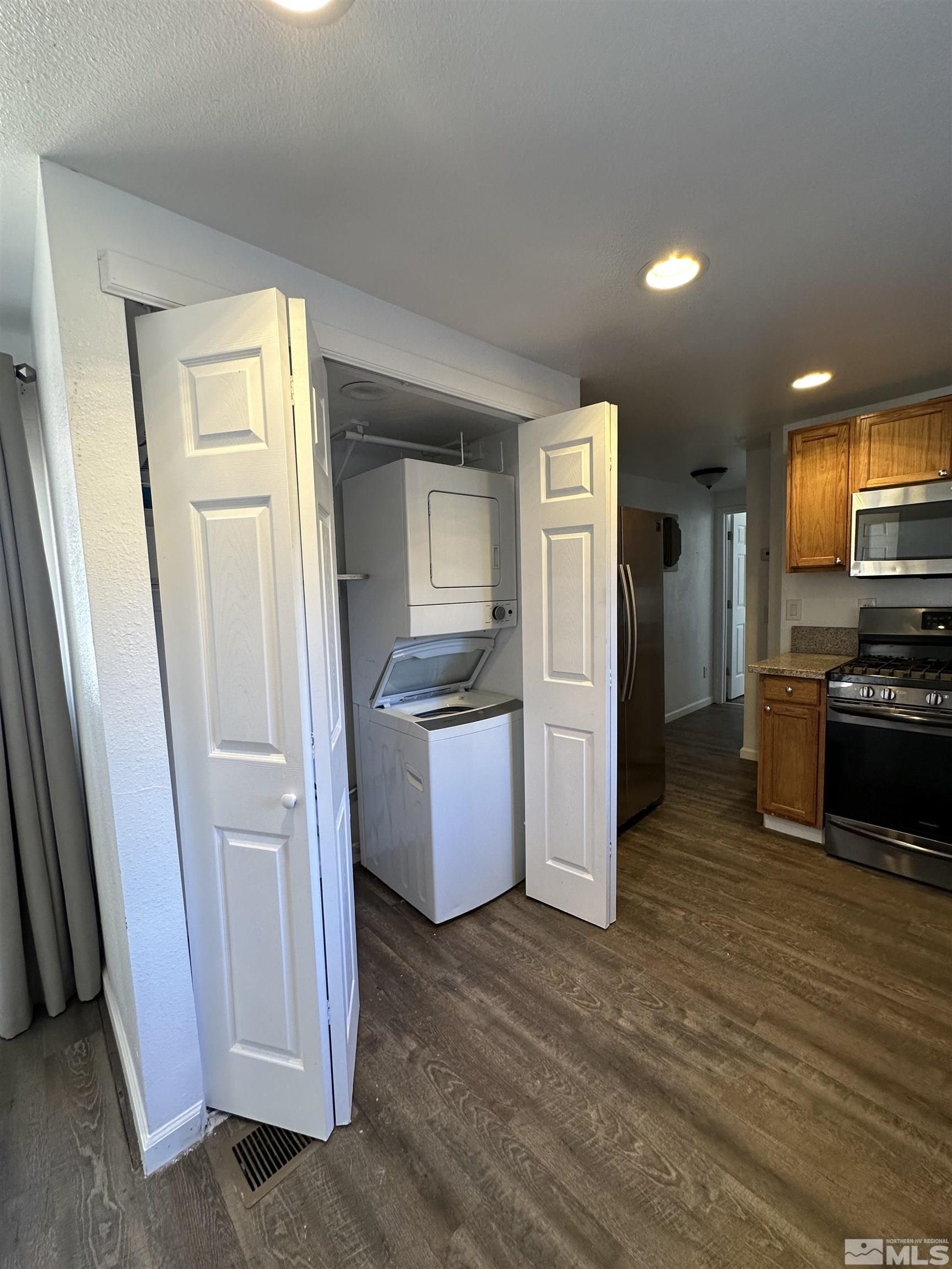 15119 Kivett Lane Reno, NV 89521 - Photo 8 of 20 a kitchen with a refrigerator sink and stove top oven
