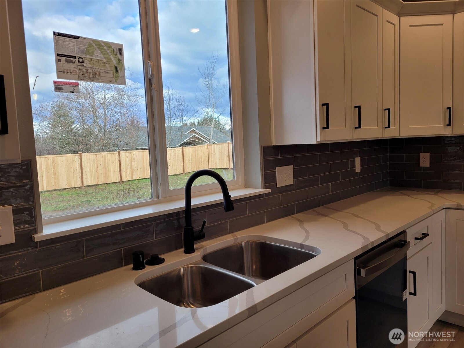 22 Raven Lane Elma, WA 98541 - Photo 11 of 21 a kitchen with granite countertop a sink and cabinets