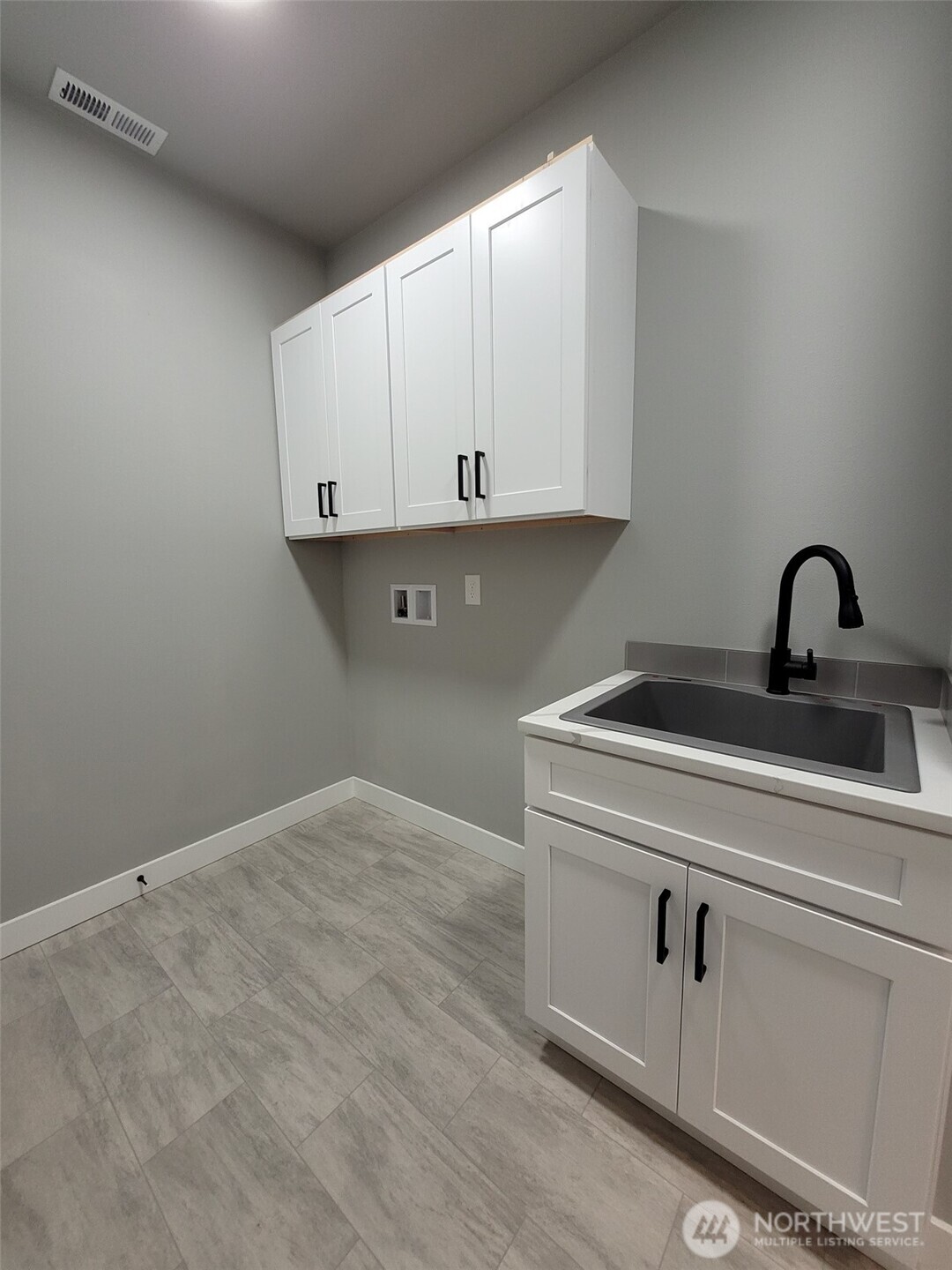 22 Raven Lane Elma, WA 98541 - Photo 20 of 21 a view of a kitchen with sink and cabinets