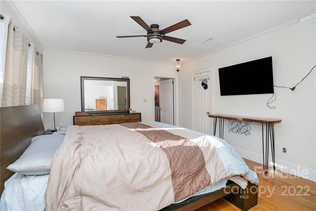 660 6th Street Northwest Hickory, NC 28601 - Photo 15 of 39 a bedroom with a bed and a flat screen tv