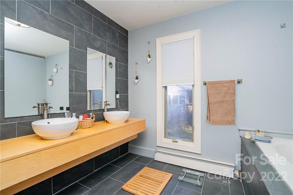660 6th Street Northwest Hickory, NC 28601 - Photo 17 of 39 a room with two sinks and a table