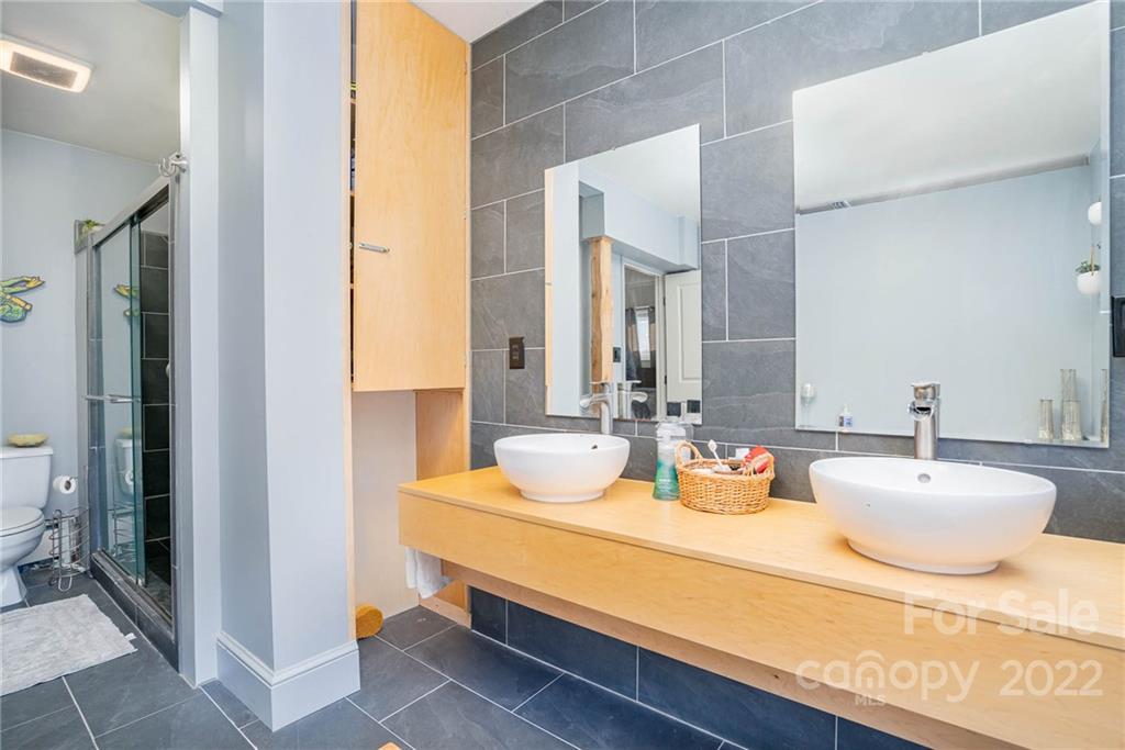 660 6th Street Northwest Hickory, NC 28601 - Photo 18 of 39 a bathroom with double vanity sinks and a mirror