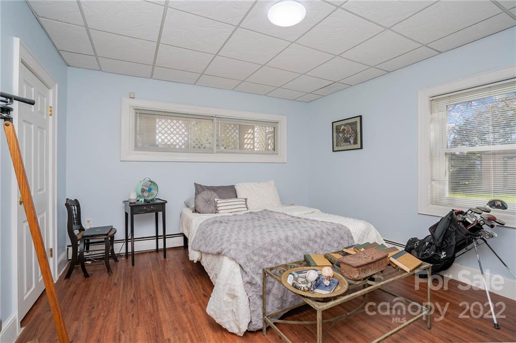 660 6th Street Northwest Hickory, NC 28601 - Photo 28 of 39 a bedroom with a bed and a table in it
