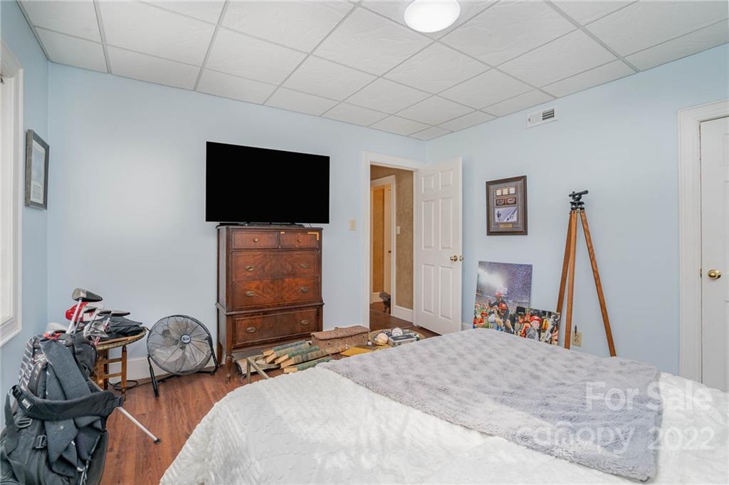 660 6th Street Northwest Hickory, NC 28601 - Photo 29 of 39 a bedroom with bed and a flat screen tv