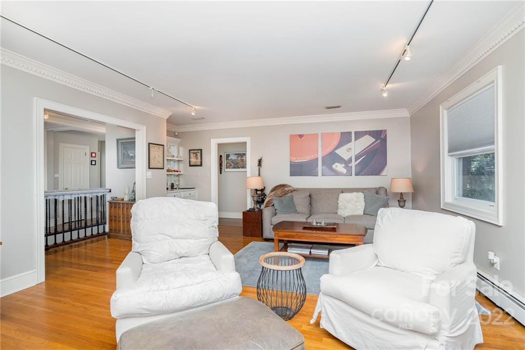 660 6th Street Northwest Hickory, NC 28601 - Photo 7 of 39 a living room with furniture and a painting on the wall