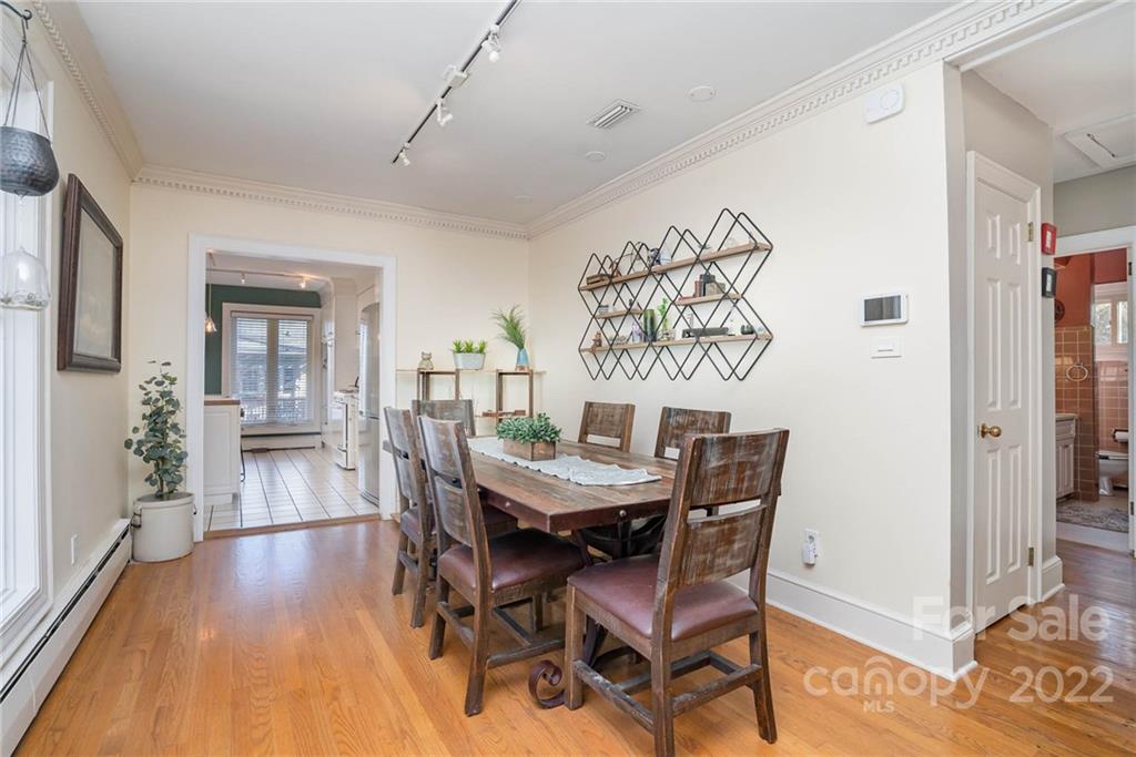 660 6th Street Northwest Hickory, NC 28601 - Photo 10 of 39 a view of a dining room with furniture and wooden floor