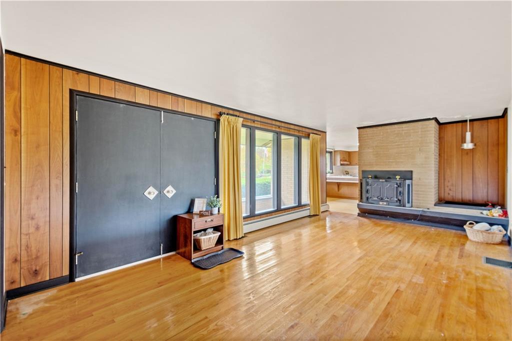 1606 Nine Eighty Road Canonsburg, PA 15317 - Photo 3 of 25 Large windows to let in nartural light and wood burning fireplace.