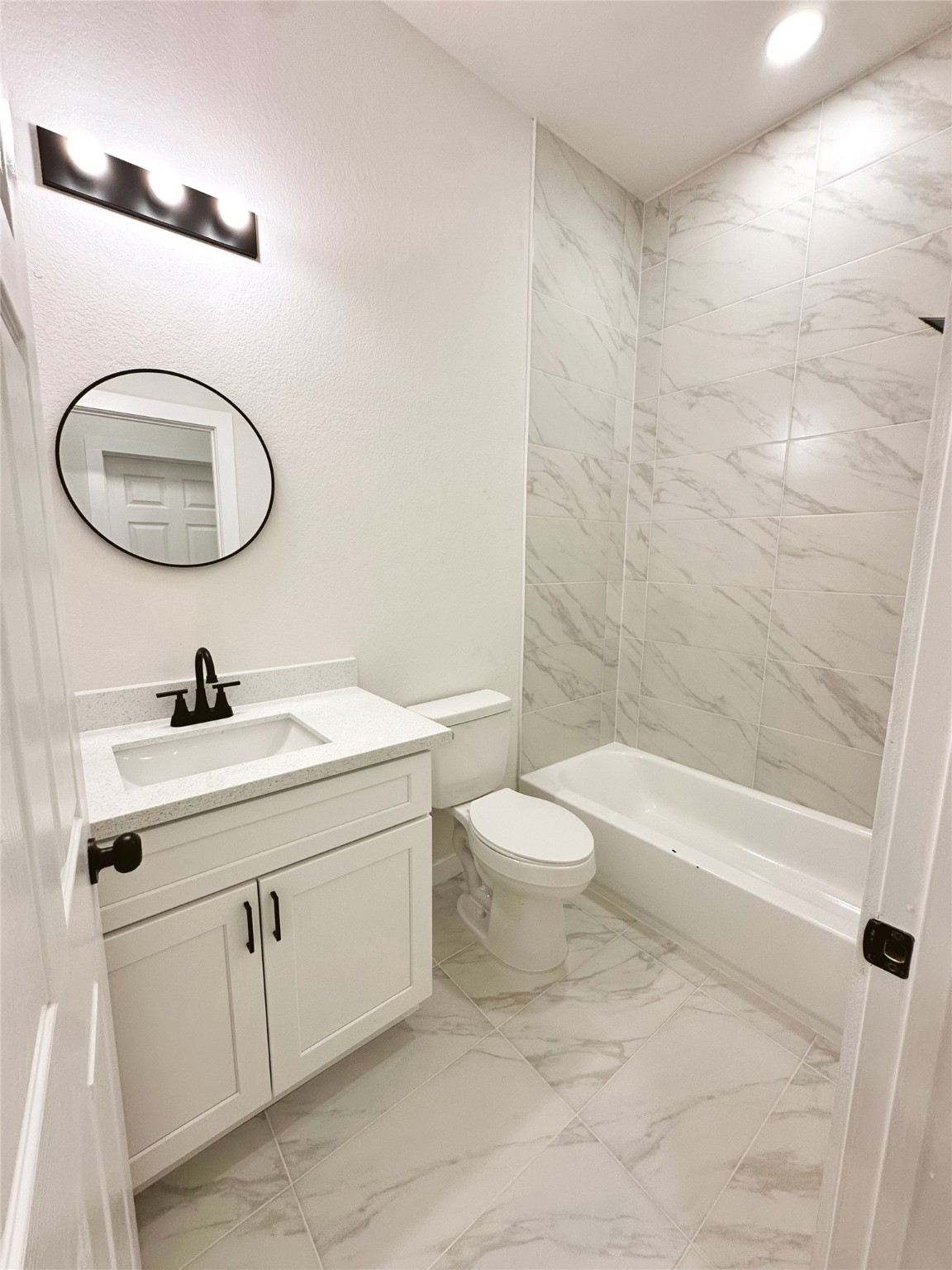 9723 Kerr A-b Street Houston, TX 77029 - Photo 11 of 22 a bathroom with a sink a toilet and shower