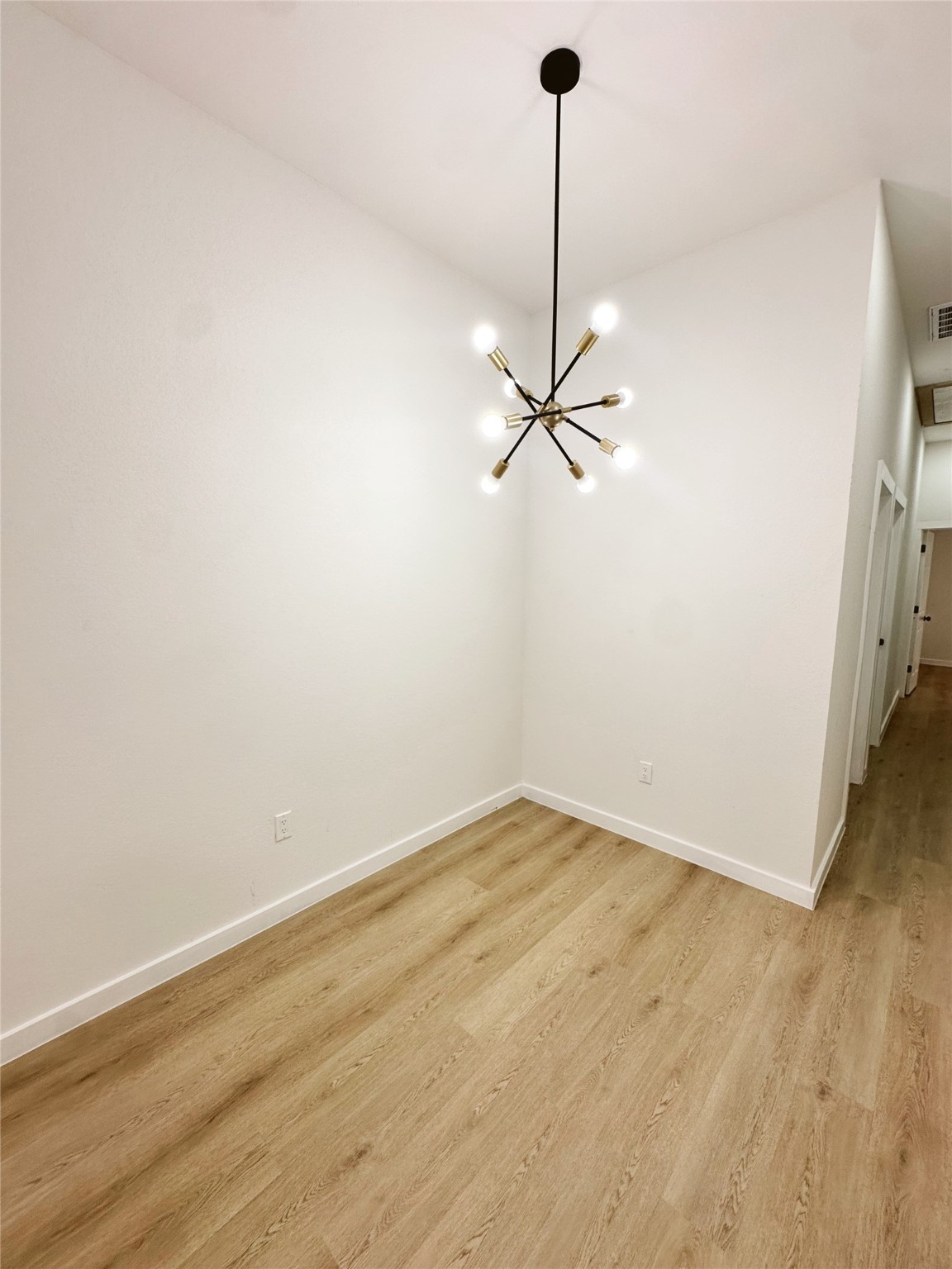 9723 Kerr A-b Street Houston, TX 77029 - Photo 7 of 22 a view of a room with an empty space and a ceiling fan