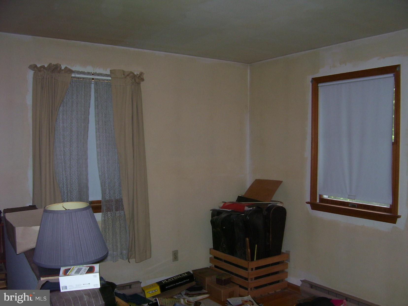 332 Hunters Road Mohnton, PA 19540 - Photo 13 of 16 a room with a chair and potted plant on a table
