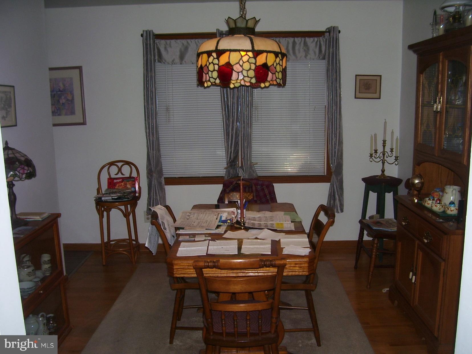 332 Hunters Road Mohnton, PA 19540 - Photo 7 of 16 a view of a dining room with furniture and chandelier