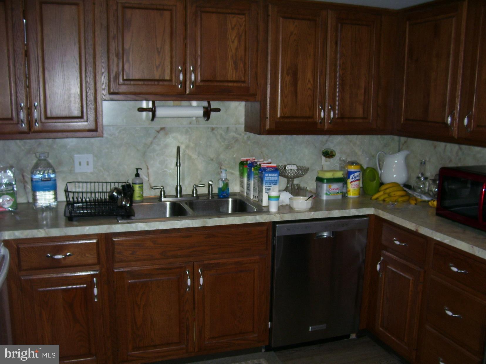 332 Hunters Road Mohnton, PA 19540 - Photo 8 of 16 a kitchen with stainless steel appliances granite countertop wooden cabinets and a sink