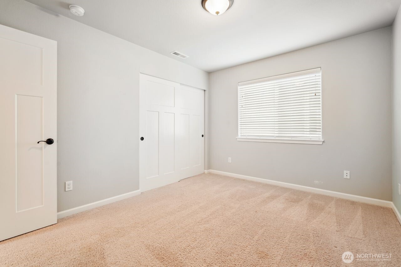 4335 Dudley Drive Northeast Lacey, WA 98516 - Photo 12 of 39 a view of an empty room with a window