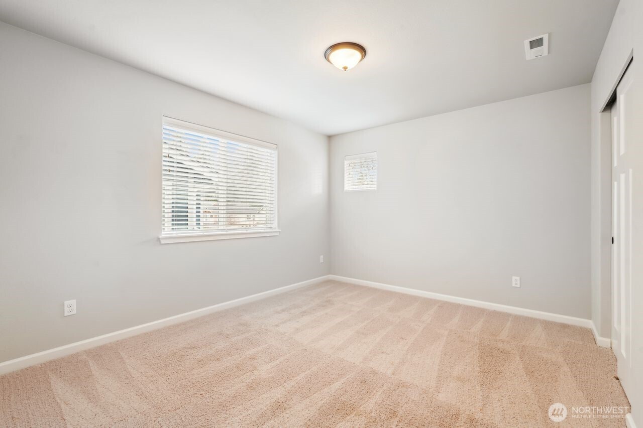 4335 Dudley Drive Northeast Lacey, WA 98516 - Photo 16 of 39 a view of an empty room with a window