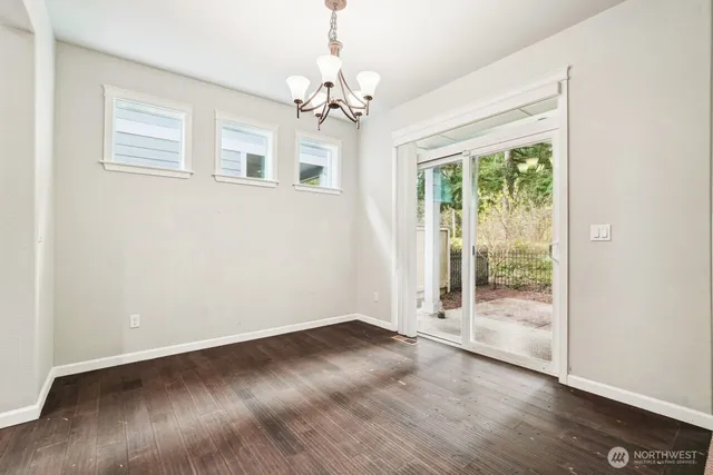 a view of kitchen with a sink and refrigerator