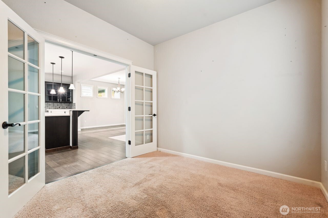 4335 Dudley Drive Northeast Lacey, WA 98516 - Photo 31 of 39 a view of a kitchen with refrigerator and more cabinets